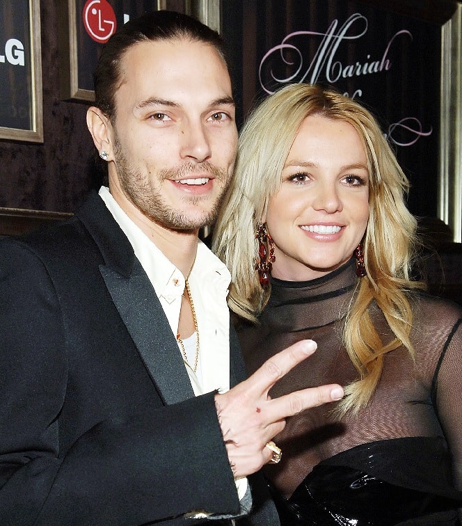 Kevin Federline and Britney Spear together smiling in their matching black outfit